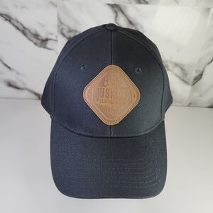 Muskoka Bear & Wear. Dark Grey Hat with Brown Patch.